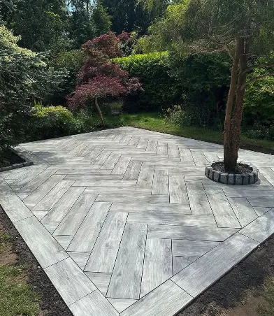Wood-effect porcelain patio laid in herringbone pattern by SureLay UK