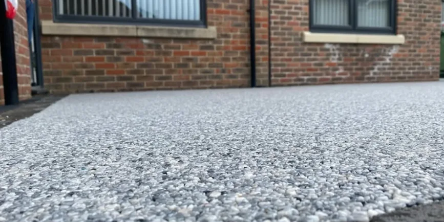 Resin bound driveway installed in Daltex Grigio Grey finish