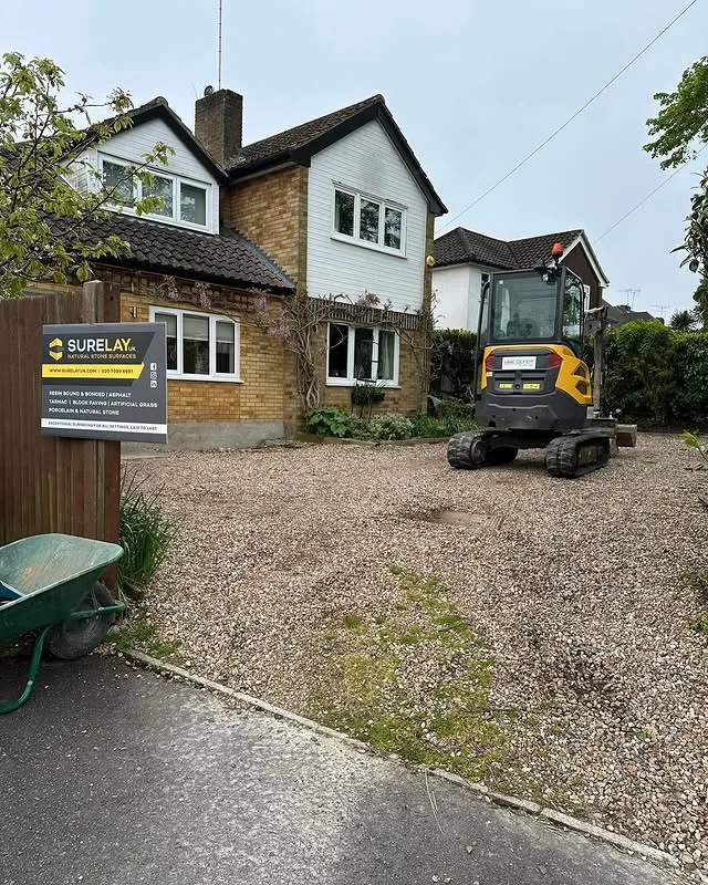 SureLay UK groundworks team using a mini excavator to prepare a driveway sub-base