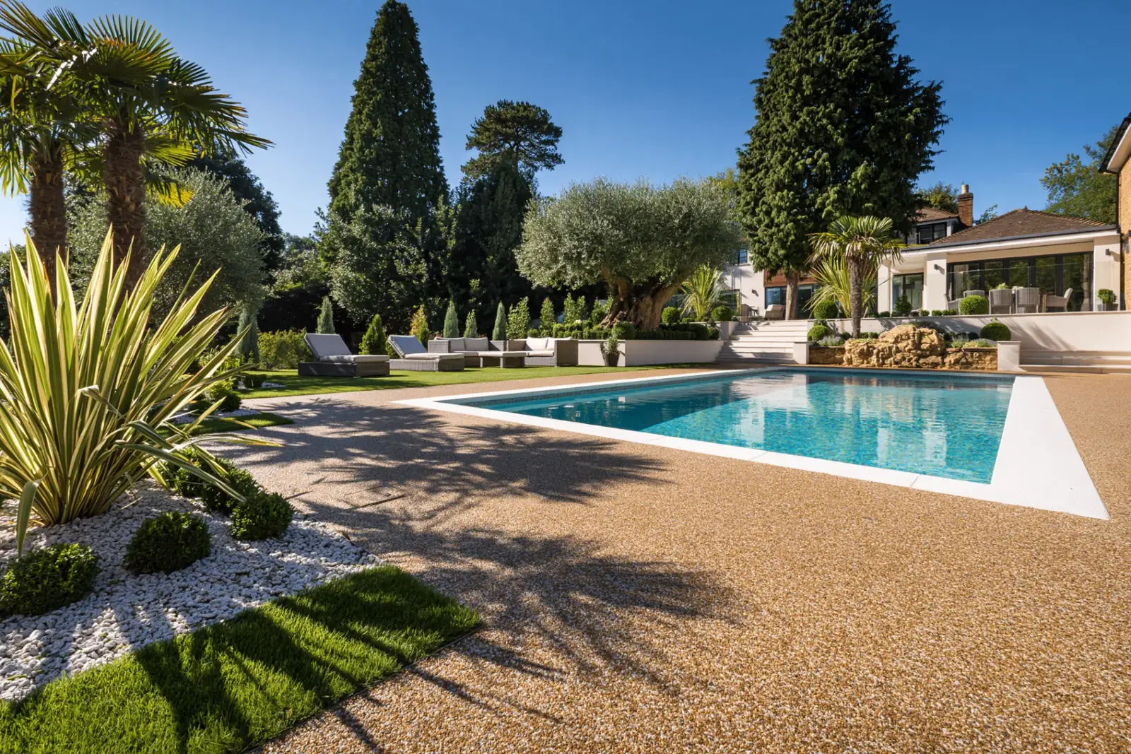 Resin bound pool surround in a landscaped Berkshire garden